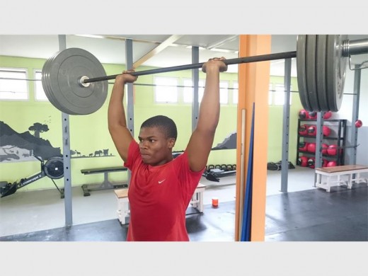 Power: Thabani Shanzi raises a sweat at the new gym at the Marburg Youth Centre.