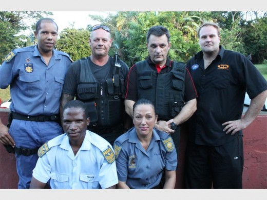  Working together to combat crime are (back from left) Constable Earl Ward, Anthony Vlok and Mark Thomas of Wolf Security and Rowan Adamson together with Sergeant Thabo Zamisa and Constable Jacky Marais.