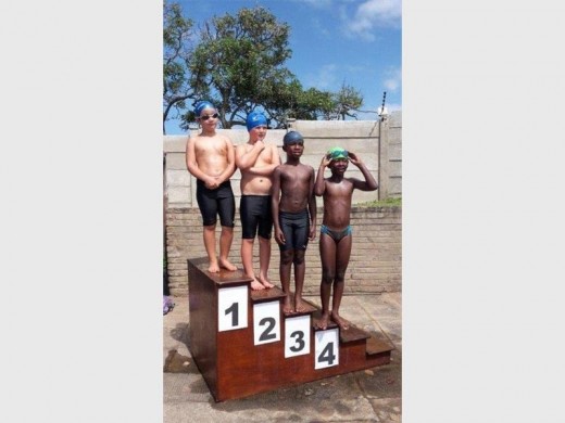 Foundation phase swimmers (from left) Brayden Jardim, Duncan Simpson, Aphile Zweni and Nthatho Mazwi were rewarded for their efforts at last week’s gala held at Port Edward Primary.