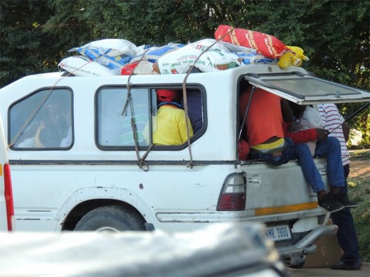 We watched, with amazement - the loading of this informal taxi. The last passenger in had to leave his legs danlging out of the bin.