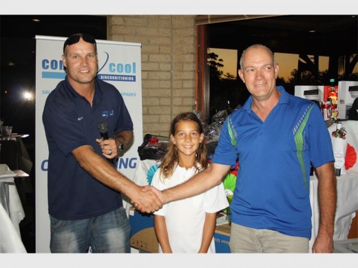 Cool prize: Dave Jenkinson (right) wins an air conditioner in a raffle sponsored by Comfort Cool to raise funds for Simoné Ferreira’s trip to play in the USA. Martin Otto does the honours.