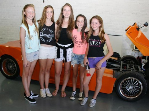 Revving good time: Impressed with the cars on display are (from left) Lauren Barnes, Lona Marr, Jade Barnes, Nicole Barnes and Belinda Visser.