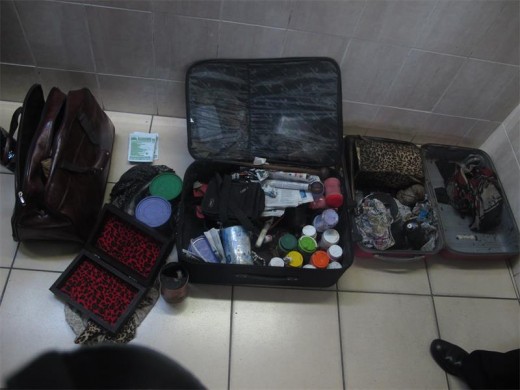 Bag of tricks: Police seized these items including clothing, muthi and envelopes from the three men. 5529SN