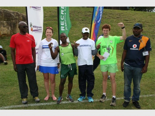Race well run: Hibiscus Coast Municipality Councillor Doc Njoko (left) and ? (right) congratulate various winners on their results, namely (from left) Belinda Hope (40-49 category), ?, ?, Fred Goodhead (6,5km winner) and ? OTHER NAMES TO COME