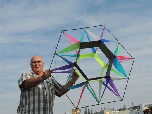 Southport kite collector and flyer Stewart Booth with one of his more complex and colourful kites.