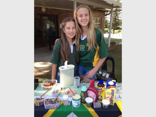 Gr 7 pupils Cameron Oelerking (left) and Billy Engelbrecht sell their wares at the cake sale held last week.