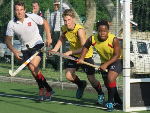 Creston College senior hockey players (from left) Keegan Cooper, Chris Cushway and Grant Joubert-Nel defend their goal against Felixton.