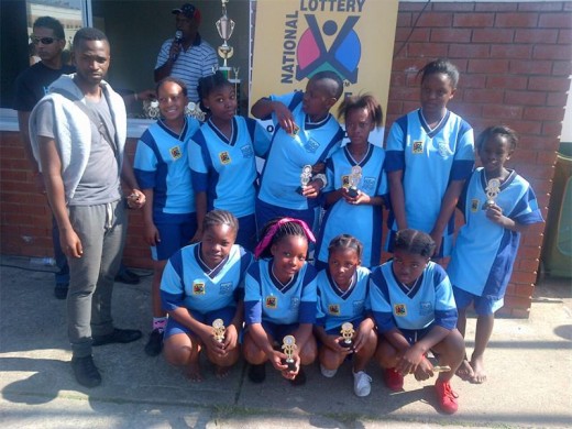 Hlanganani coach Boysie Ndwalane (left) was on hand to encourage volley ball players (back, from left) Mamela Nyandeni, Noluthando Ndlovu, Nomonde Nzimande, Nombuso Shabalala, Zotha Makhaye, Ngqobe Asaphiwe, (front) Anele Cele, Thandeka Rolando, Lungile Nzama and Noluthando Thusi at last weekend's game against Marburg Primary.