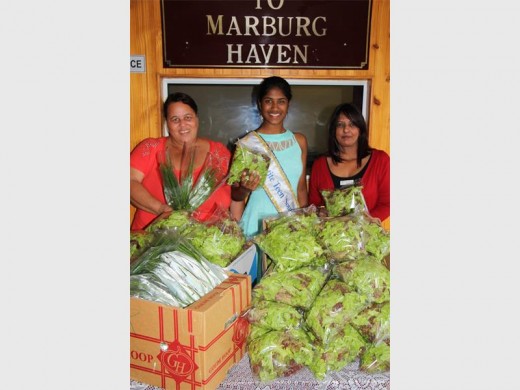 Creleisha Moodley did not waste any time and went out on her first charity drive and donated lettuce and chives to Marburg Haven, which feeds many pensioners from Monday to Friday. Accepting the donation are Cindy Damas (left) and Vanessa Reginald from Marburg Haven.