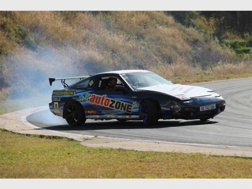 Burn rubber: Joey Govender screeches around a corner.  6432vee