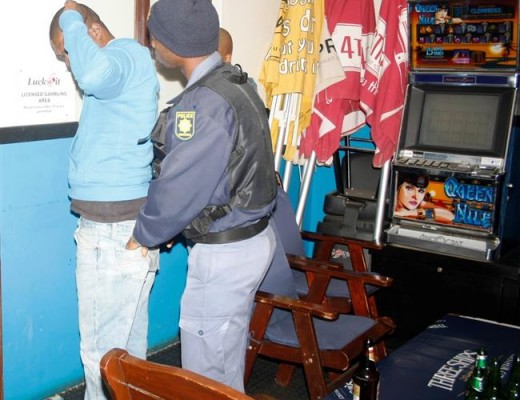 A suspect is searched. (SUPPLIED)