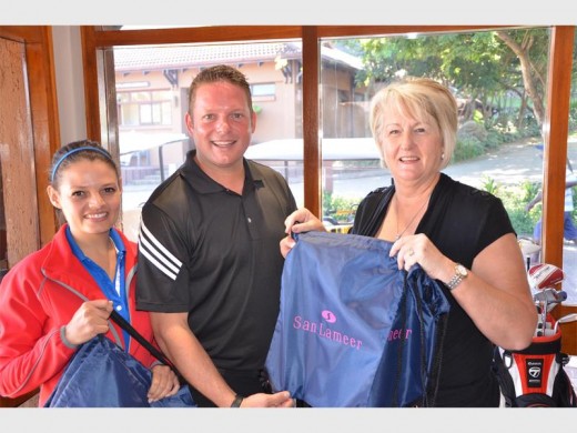 Thanks: Linda Rybicki receives a goodie bag from San Lameer CC's Meyer and Vickey-Lee du Toit.