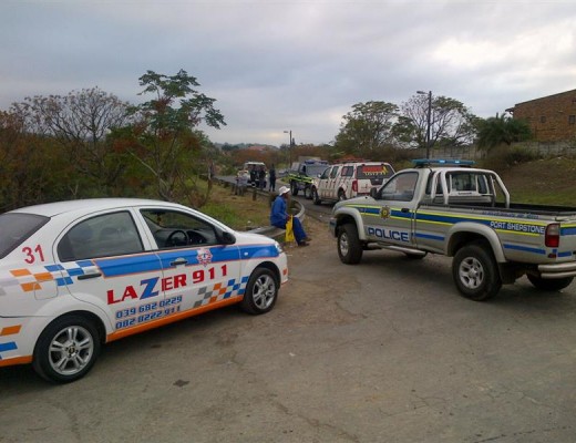 Police gather at the scene.