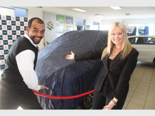 Time for the unveiling: Chazlin Haskins, Suzuki Auto SA's District Sales Controller, and Kate Hulley (Suzuki South Coast marketing) can't wait to get a closer look at the big prize.