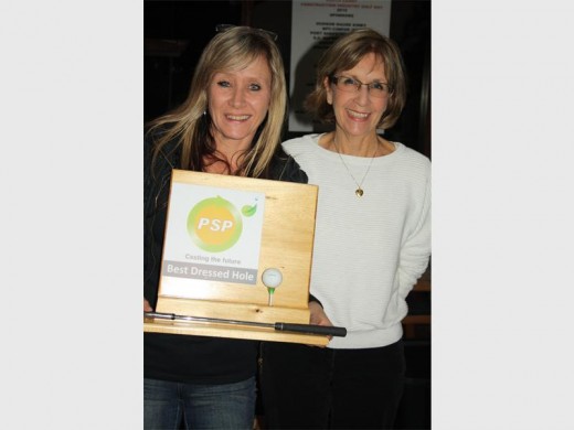 Best dressed:  Jean Osborne (left), who made everyone wear nappies to tee off on the 16th, won 'Best Dressed (or undressed) Hole'. Here she proudly displays the trophy her own company (Port Shepstone Precast) donated some years ago with Sue Kirby.