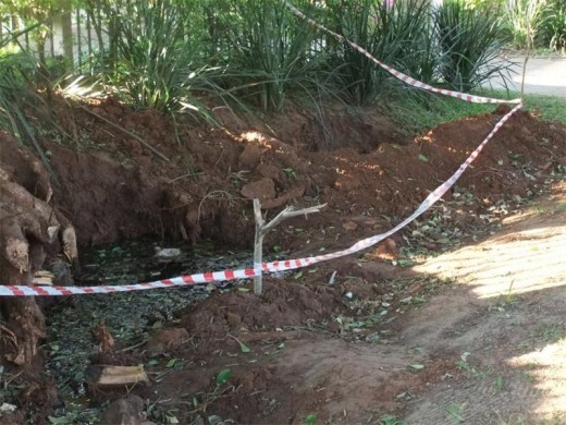A water-filled hole abandoned by Ugu.