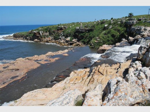 The Mkambati River drops over a series of waterfalls into the Indian Ocean.