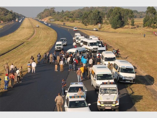 Roadblock: Angry taxi operators blocked the Park Rynie off-ramp protesting against President Zuma's controversial nephew, Mfundo Gcaba, who allegedly wants to muscle his way into the South Coast routes.