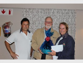 Long service: Port Shepstone bowls president, Kevin Lancaster (left) joined club chairman Leon Reeders in congratulating Jenny Rawlins after she received the President's Prize for long service to the bowling community.