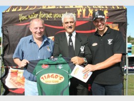 Kind hearts: Dougie Haralambous (middle), president of the Southern KwaZulu-Natal Rugby Union, thanks Craig Mitchell (left) of Riversmead Farm and Andrew Ramos of Tiago's for their kind sponsorship of new rugby kits. 2940vee
