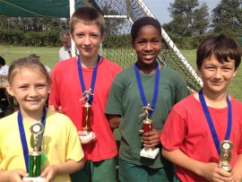 Intermediate and senior phase athletics winners (from left) junior victrix ludorum Erin Swart, senior victor ludorum Tian Prinsloo, senior victrix ludorum Zamo Nyawose and junior victor ludorum Byron Winrow.