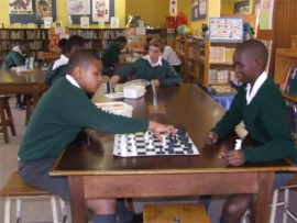 Chess players Mvuko Nonkonyana (left), Haedyn Buchannan, and Sphumelele Mavundla.