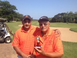 Well played: Rubby Dullay (right) hands Pravesh Govender his trophy for winning the Pro-Vision monthly mug at Port Shepstone Country Club recently. The next monthly mug will take place at Port Shepstone CC this Sunday, October 4.