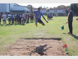 Mihlali Jona soars in the long jump.