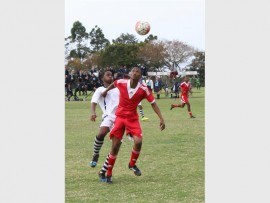 Southcity and Adams College players battle it out. 