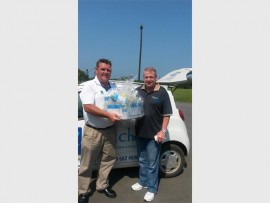 Thank you very much: Steve McCarroll (right) was the winner of a hamper sponsored by Qual Chem at the recent Creston College Day at Port Shepstone CC. Handing over the goods is Gary James of Qual Chem.