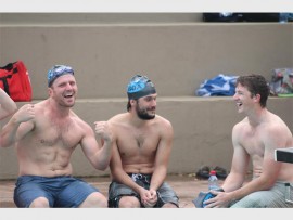 Ripped: Jonathan 'Chad le Clos' Vogt, Vince van Niekerk and Darren Ovenstone catch a tan at the swimathon.