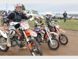 Family affair: A proud father takes his sons through the ‘pee wee’ course at the Paddock County Ford off-road motorbike  ride last Sunday.