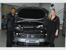 Lovely car: James Nyawose (sales executive) and Kate Hulley (marketing) welcome customers to the open day. 6904vee