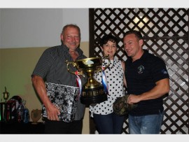 Fantastic contribution: The Chairman's Award went to the Mitchell family this year. Receiving the award are (from left) Craig and Sandy and their son Chris. The live-wire scrumhalf also picked up awards for Most Dedicated Player, Most Points Scored and Best Defender.