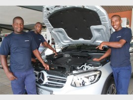 Roaring: Looking at the engine are (from left) Musa Dlamini, Zamo Ndovela and Siya Shozi of Gamalakhe. 0418vee
