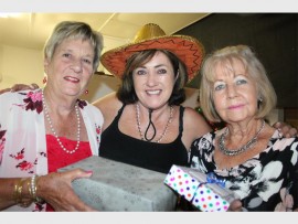 Giving hearts: Having a ball at the 'Toys for Joy Mexican Night' last Saturday are (from left) Sandy Ferguson, Carrie Johnson and Jean Bouverie.