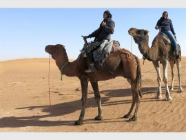 Adventurous: Tweni couple, Co and Evelyn take a camel ride through Morocco.