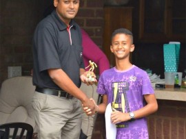 On the up: Cameron de Vries receives his Players' Player of the Year trophy from Vinny Naidoo, representing the sponsor, Hino.