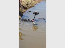 Oops: Yzelle Greyling's golf cart takes a tumble during the South Coast Regional golf champs at Port Shepstone CC. We won't say if it was a forced swim, or one taken voluntarily.