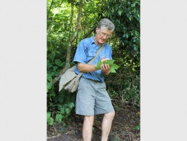 Rare flora: Botanist and speaker, Geoff Nichols, is collecting seeds of one of the rare trees on the Tweni Conservancy Walk last Sunday morning.img2665