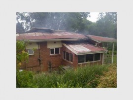 Destroyed: A house situated on Harding Primary School property went up in flames last Saturday night.