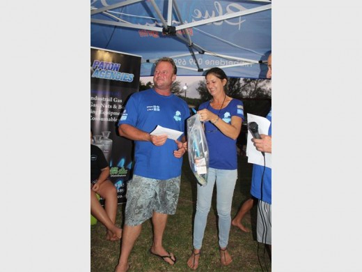 Luck of the draw: Jenni Defilippi hands over the top prize to fisherman Andre Laubscher in the lucky draw at the Hibberdene Easter Fishing Competition held last Sunday. img8184