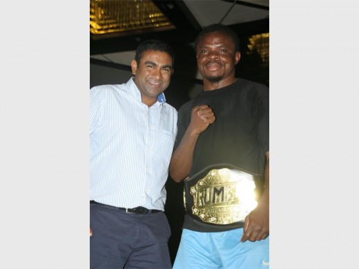 Victory: General manager of the Wild Coast Sun, Myan Moodley (left) congratulates Jimmy Mabundji, who was voted the best boxer on the night. PHOTO BY VEE RAMSAYI 0073vee