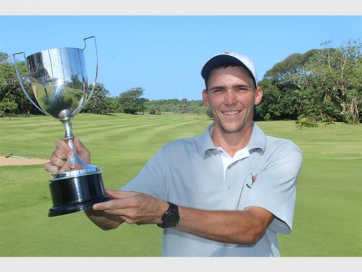 Trophy time: Graham Fabricius holds aloft the KwaZulu-Natal Country Districts trophy he won at his home course, Port Shepstone Country Club, last Friday. He shot 69 and 72 to win by two from Gavin Sole of Southbroom. He thanked his coach Colin Iddon for helping him with his game.