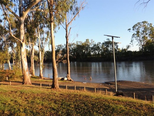 Children make full use of the camping area's swimming hole.