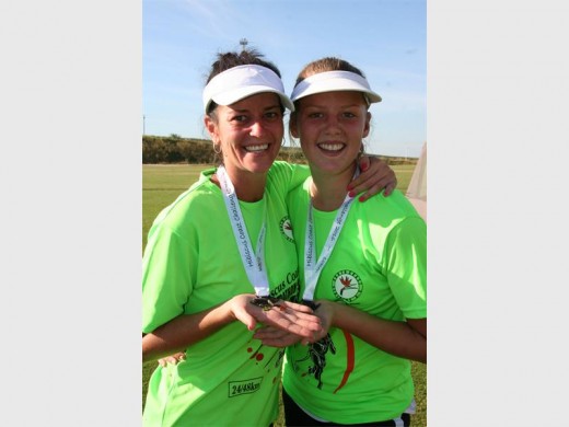 Well deserved: Showing off their medals after completing the Hibiscus Coast Challenge are Linsey Swinney (left) and her daughter Jessica. 0867vee