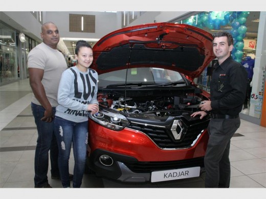 Power plant: Sales executive Kelly Dawes (right) explains to Ivan and Sherelle Pillay the specs of the engine. 1002vee