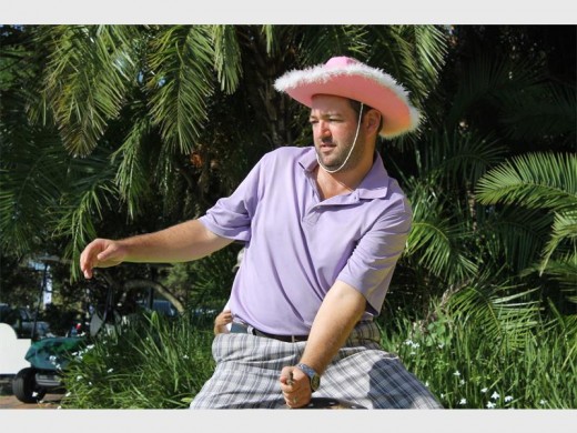 Pink cowboy: Christo van Vuuren rides the bull at the Master Builders' Association annual golf day at the Wild Coast Sun last Friday.