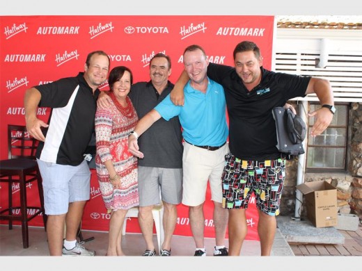 Runners-up: Sponsors Liz and Brian Jones from Halfway Toyota flanked by runners-up in the two day Restoration Weekend, from left, Ryan Ringo, Grant Paterson and Steven Herbst. The boys are symbolically  'hugging' their 'ghost' player who replaced team member Daryl D'Arcy who could not make it on the last day.