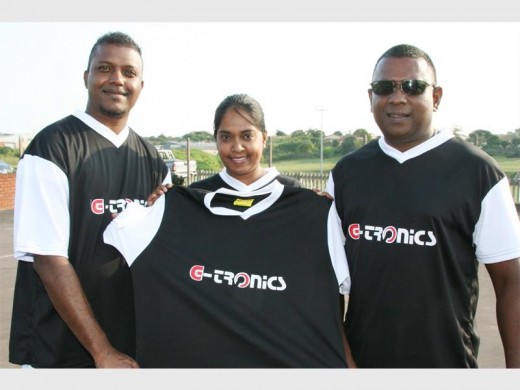 Kind deed: Gary Samuel (right) proudly presents Clinton Pillay (manager of New Covenant City men's team) and Justine Pillay (manager of New Covenant City women's team) with brand new T-shirts. 3006vee